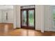 Elegant wood front doors with decorative glass panels, adding curb appeal to this home at 3115 Corsair Curv, Cumming, GA 30040