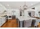 Updated kitchen with a large kitchen island, stainless steel appliances and modern lighting at 3115 Corsair Curv, Cumming, GA 30040