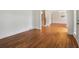 Open living room features hardwood floors and white trim throughout at 3115 Corsair Curv, Cumming, GA 30040