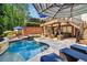 Inviting in-ground pool with lounge seating and covered patio area at 3115 Corsair Curv, Cumming, GA 30040
