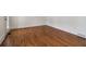 Room features hardwood floors, white walls and baseboards at 3115 Corsair Curv, Cumming, GA 30040