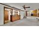 Inviting living room with a wooden bar, cozy lighting, and seamless access to the kitchen at 5618 Fern Creek Sw Dr, Lilburn, GA 30047