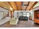 Inviting sun room featuring wood ceilings, brick floors, and ample natural light from large windows for a tranquil space at 5618 Fern Creek Sw Dr, Lilburn, GA 30047