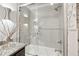 Close-up of a stylish bathroom featuring granite-topped vanity and tiled shower-over-tub at 103 Mill Pond Rd, Roswell, GA 30076