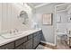 Elegant bathroom featuring beadboard accents, a vanity, and a neutral color palette at 103 Mill Pond Rd, Roswell, GA 30076