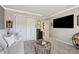 Well-lit bedroom with neutral walls, closet, and carpet at 103 Mill Pond Rd, Roswell, GA 30076