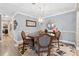 Charming dining room with modern chandelier, elegant decor, and neutral paint colors at 103 Mill Pond Rd, Roswell, GA 30076