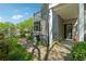 Inviting townhome exterior with charming walkway and beautiful lake view on a sunny day at 103 Mill Pond Rd, Roswell, GA 30076
