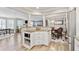 Open-concept kitchen featuring granite countertops, white cabinets, and a breakfast bar at 103 Mill Pond Rd, Roswell, GA 30076