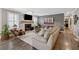 Elegant living room features a cozy fireplace, hardwood floors, and neutral paint colors at 103 Mill Pond Rd, Roswell, GA 30076