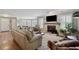 Spacious living room featuring a stone fireplace and stylish furniture on hardwood floors at 103 Mill Pond Rd, Roswell, GA 30076