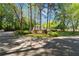 Community entrance with 'Hidden Lake' signage surrounded by manicured landscaping at 103 Mill Pond Rd, Roswell, GA 30076