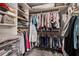Organized walk-in closet with ample shelving and hanging space at 103 Mill Pond Rd, Roswell, GA 30076