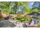 Spacious backyard with a patio, outdoor seating, and a playset at 1256 Spring Valley Ne Ln, Atlanta, GA 30306