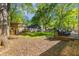 Large backyard with lush greenery and a playset, perfect for outdoor activities at 1256 Spring Valley Ne Ln, Atlanta, GA 30306