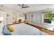 This spacious bedroom has hardwood floors, and neutral tones, with a ceiling fan at 1256 Spring Valley Ne Ln, Atlanta, GA 30306