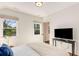 Bedroom featuring hardwood floors, natural lighting, and modern minimalist decor at 1256 Spring Valley Ne Ln, Atlanta, GA 30306