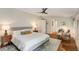 This spacious bedroom has hardwood floors, and neutral tones, with a ceiling fan at 1256 Spring Valley Ne Ln, Atlanta, GA 30306