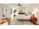 This bright bedroom has hardwood floors, and neutral tones, with a ceiling fan at 1256 Spring Valley Ne Ln, Atlanta, GA 30306