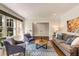 Bright living room with hardwood floors, comfortable seating, and ample natural light at 1256 Spring Valley Ne Ln, Atlanta, GA 30306