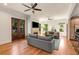 Open-concept living room with hardwood floors, fireplace, and access to the backyard at 1256 Spring Valley Ne Ln, Atlanta, GA 30306