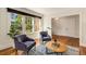 Bright, airy living room with hardwood floors, large windows and comfortable seating at 1256 Spring Valley Ne Ln, Atlanta, GA 30306