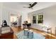 Bright and airy office with a sleek ceiling fan, hardwood floors and views of lush greenery at 1256 Spring Valley Ne Ln, Atlanta, GA 30306