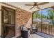 Relaxing screened porch with brick accents, ceiling fan, and cozy seating at 1256 Spring Valley Ne Ln, Atlanta, GA 30306