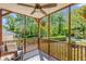 Inviting screened porch with comfortable seating and beautiful outdoor views at 1256 Spring Valley Ne Ln, Atlanta, GA 30306