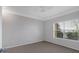 Bedroom with ceiling fan, neutral carpet and lots of light from the windows at 1850 Cotillion Dr # 4204, Dunwoody, GA 30338