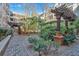 Picturesque view of the community garden featuring winding brick paths, mature trees, and shade for enjoyment at 1850 Cotillion Dr # 4204, Dunwoody, GA 30338