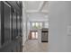 Inviting entryway with tile floors, granite counter, stainless appliances, and open sight lines to the living area at 1850 Cotillion Dr # 4204, Dunwoody, GA 30338