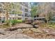 Lush community grounds with a decorative bridge over a serene stream, adding a peaceful touch at 1850 Cotillion Dr # 4204, Dunwoody, GA 30338