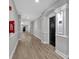 Clean and well-maintained hallway featuring modern lighting, wood-style floors, and unit number for easy navigation at 1850 Cotillion Dr # 4204, Dunwoody, GA 30338