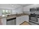 Kitchen featuring stainless steel appliances, granite countertop and natural light at 1850 Cotillion Dr # 4204, Dunwoody, GA 30338