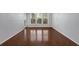 Living room with hardwood floors, and windows offering natural light at 1850 Cotillion Dr # 4204, Dunwoody, GA 30338