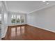 Spacious living room featuring hardwood floors and large windows at 1850 Cotillion Dr # 4204, Dunwoody, GA 30338