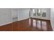 Bright living room featuring gleaming hardwood floors and plenty of light at 1850 Cotillion Dr # 4204, Dunwoody, GA 30338