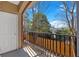 Balcony with black metal railing with a partial view of the trees at 1850 Cotillion Dr # 4204, Dunwoody, GA 30338