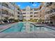Inviting outdoor pool with clear blue water, surrounded by lounge chairs and well-maintained landscaping at 1850 Cotillion Dr # 4204, Dunwoody, GA 30338