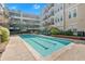 Beautiful community pool surrounded by lush greenery and seating areas, perfect for relaxation at 1850 Cotillion Dr # 4204, Dunwoody, GA 30338