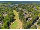 Aerial view of a neighborhood community with lake and golf course at 2120 Blackheath Trce, Alpharetta, GA 30005