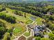 Aerial view of a golf course, clubhouse and housing community at 2120 Blackheath Trce, Alpharetta, GA 30005