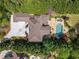 Overhead view showing expansive property featuring pool, patio, circular drive, and lush landscaping at 2120 Blackheath Trce, Alpharetta, GA 30005