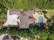 Expansive backyard features a large pool, patio area, lush landscaping, and a meticulously maintained lawn at 2120 Blackheath Trce, Alpharetta, GA 30005