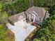 Aerial view showcasing a luxurious home with a long driveway and lush greenery, offering privacy at 2120 Blackheath Trce, Alpharetta, GA 30005