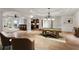 Spacious basement with travertine floors, a pool table, bar, and comfortable seating area at 2120 Blackheath Trce, Alpharetta, GA 30005