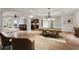 Open basement features a pool table, lounge area, and bar with modern finishes at 2120 Blackheath Trce, Alpharetta, GA 30005