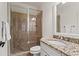 This bathroom features a vanity with granite countertops and a beautiful shower with a glass enclosure at 2120 Blackheath Trce, Alpharetta, GA 30005