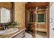 Relaxing bathroom features a sauna, granite countertop, and decorative accents at 2120 Blackheath Trce, Alpharetta, GA 30005